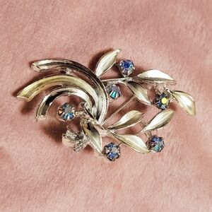 Elegant Silver Brooch with Blue Accents